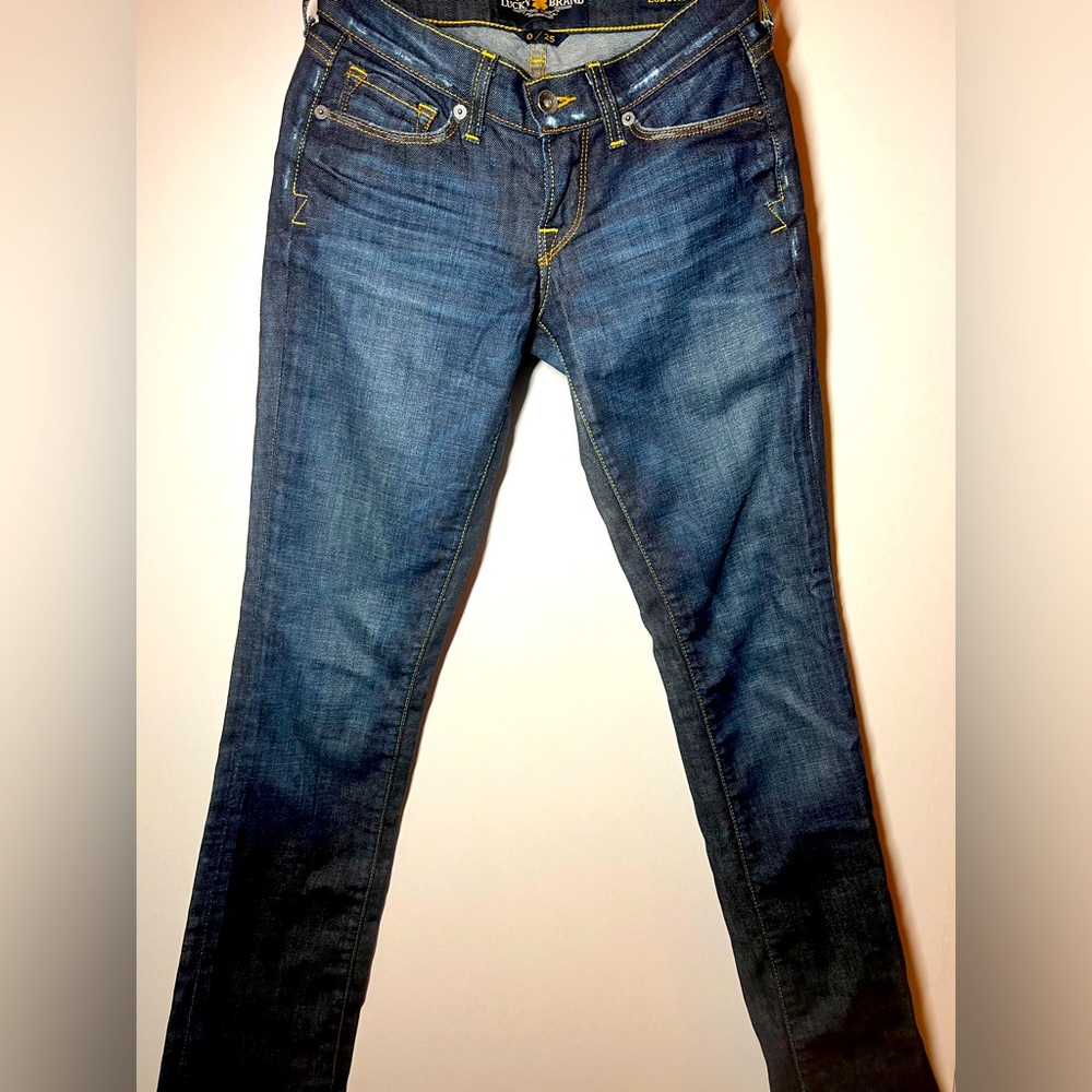 Like new. Only tried on once. Very light distressed style. Super dark wash.